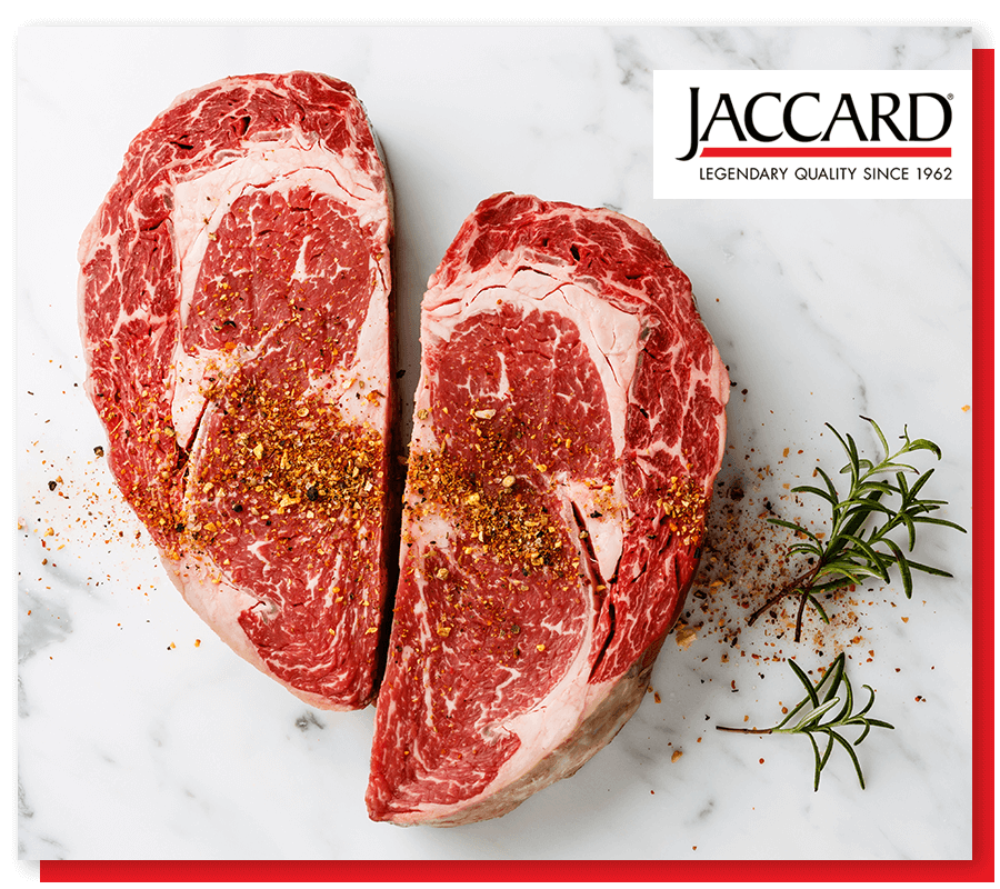 image of two raw steaks getting prepared to cook