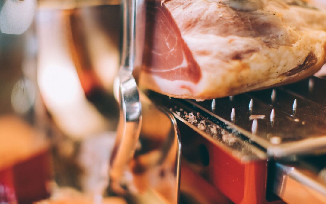 automatic meat slicer cutting up meat